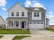 Charming two-story home features a two-car garage, covered porch, and well-manicured lawn at 4193 Bozeman Way, Bargersville, IN 46106