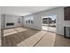 Bright living room featuring a modern fireplace and sliding glass door to the outdoors at 4193 Bozeman Way, Bargersville, IN 46106