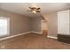 Cozy bedroom with neutral walls, carpet flooring, ceiling fan, and natural light from the window at 741 Greer St, Indianapolis, IN 46203