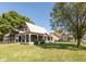 Charming home exterior with inviting front porch and mature trees in a lush yard at 741 Greer St, Indianapolis, IN 46203