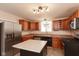 Functional kitchen with stainless steel appliances, ample cabinets, and a center island for cooking at 741 Greer St, Indianapolis, IN 46203
