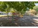 Community playground with colorful slides, climbing structures, and a soft, mulched surface at 741 Greer St, Indianapolis, IN 46203