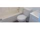 A clean and modern bathroom features a toilet, shower, and vanity at 2021 N Graham Ave, Indianapolis, IN 46218