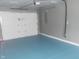 A spacious garage with a sealed floor and a white door at 2021 N Graham Ave, Indianapolis, IN 46218