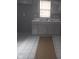 Kitchen sink with gray cabinets and a window at 2021 N Graham Ave, Indianapolis, IN 46218