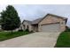 Charming brick home with a well-manicured lawn and a two-car garage, set on a cloudy day at 3784 Mansfield Dr, Brownsburg, IN 46112