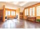 Spacious bonus room features hardwood floors, natural light, and built-in shelves, perfect for hobbies or storage at 7258 N Richardson Dr, Morgantown, IN 46160