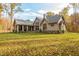 Beautiful home featuring stone exterior, well-manicured yard and mature trees at 7258 N Richardson Dr, Morgantown, IN 46160