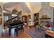 Spacious living room features a stone fireplace, wood floors, and floor-to-ceiling bookshelves at 7258 N Richardson Dr, Morgantown, IN 46160