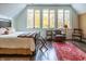 Large main bedroom with dark hardwood floors features a sitting area and oversized windows at 7258 N Richardson Dr, Morgantown, IN 46160