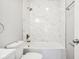 Clean bathroom with marble tile shower/tub combo at 2018 Rembrandt St, Indianapolis, IN 46202