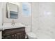 Modern bathroom with marble tile and dark vanity at 2018 Rembrandt St, Indianapolis, IN 46202