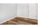 Neutral colored bedroom with hardwood floors and a door at 2018 Rembrandt St, Indianapolis, IN 46202