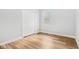 Bright bedroom with double door closet and wood-look flooring at 2018 Rembrandt St, Indianapolis, IN 46202