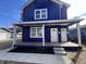 Two story new construction home with blue siding and front porch at 2018 Rembrandt St, Indianapolis, IN 46202