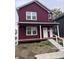 Two story new construction home with maroon siding and front porch at 2018 Rembrandt St, Indianapolis, IN 46202
