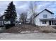 Two story new construction home with white siding, black roof and front porch at 2018 Rembrandt St, Indianapolis, IN 46202