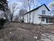 New construction home with white siding, black roof and front porch at 2018 Rembrandt St, Indianapolis, IN 46202