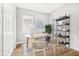 Home office featuring a desk, shelving, and wood-look flooring at 2018 Rembrandt St, Indianapolis, IN 46202
