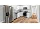 Open concept kitchen with stainless steel appliances and granite countertops at 2018 Rembrandt St, Indianapolis, IN 46202
