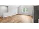 Bright living room featuring hardwood floors and neutral walls at 2018 Rembrandt St, Indianapolis, IN 46202