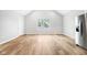 Bright living room with wood-look flooring and neutral walls at 2018 Rembrandt St, Indianapolis, IN 46202