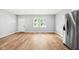 Spacious living room with light gray walls and wood-look flooring at 2018 Rembrandt St, Indianapolis, IN 46202