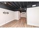 Finished basement with dark ceiling and LVP flooring at 4902 N Park Ave, Indianapolis, IN 46205