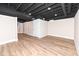Finished basement with neutral walls and LVP flooring at 4902 N Park Ave, Indianapolis, IN 46205
