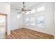 Light-filled bedroom with hardwood floors and window shutters at 4902 N Park Ave, Indianapolis, IN 46205
