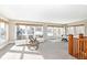 Spacious bonus room with many windows providing natural light, a seating area and an activity table at 4902 N Park Ave, Indianapolis, IN 46205
