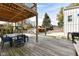 Deck with table, chairs, and grill overlooking backyard at 4902 N Park Ave, Indianapolis, IN 46205