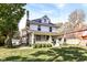 Two story house with a large yard and metal roof at 4902 N Park Ave, Indianapolis, IN 46205