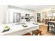 Modern kitchen featuring white cabinets, stainless steel appliances, and an island with a breakfast bar at 4902 N Park Ave, Indianapolis, IN 46205