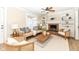 Cozy living room features a brick fireplace, built-in bookshelves, ceiling fan, and comfortable seating at 4902 N Park Ave, Indianapolis, IN 46205