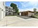 Spacious concrete parking area with covered carport and basketball hoop at 4902 N Park Ave, Indianapolis, IN 46205