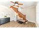 Staircase with wood steps, white walls, modern lighting, and decorative art at 4902 N Park Ave, Indianapolis, IN 46205