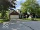 Charming two-story home with a brick facade, a well-maintained lawn, and mature trees at 534 Austrian Way, Avon, IN 46123