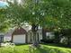 Attractive home exterior with lush lawn and large trees offering shade, perfect for curb appeal at 534 Austrian Way, Avon, IN 46123