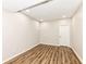 Empty basement room with wood flooring at 6252 Sugar Maple Dr, Zionsville, IN 46077