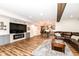 Finished basement with a bar, seating area, and entertainment at 6252 Sugar Maple Dr, Zionsville, IN 46077