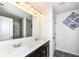 Bathroom with double vanity, large mirror, and shower at 6252 Sugar Maple Dr, Zionsville, IN 46077