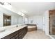 Elegant bathroom with double vanity, soaking tub, and walk-in shower at 6252 Sugar Maple Dr, Zionsville, IN 46077