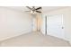 Bright bedroom with a ceiling fan and double door closet at 6252 Sugar Maple Dr, Zionsville, IN 46077