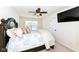 Cozy bedroom with a queen-size bed and ceiling fan at 6252 Sugar Maple Dr, Zionsville, IN 46077