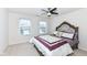 Well-lit bedroom with a queen-size bed and two windows at 6252 Sugar Maple Dr, Zionsville, IN 46077