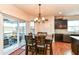 Kitchen breakfast nook with a table and access to a screened porch at 6252 Sugar Maple Dr, Zionsville, IN 46077