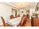 Formal dining room featuring a chandelier and hardwood floors at 6252 Sugar Maple Dr, Zionsville, IN 46077