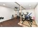 Basement home gym with various equipment at 6252 Sugar Maple Dr, Zionsville, IN 46077