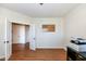Home office with hardwood floors and access to additional rooms at 6252 Sugar Maple Dr, Zionsville, IN 46077